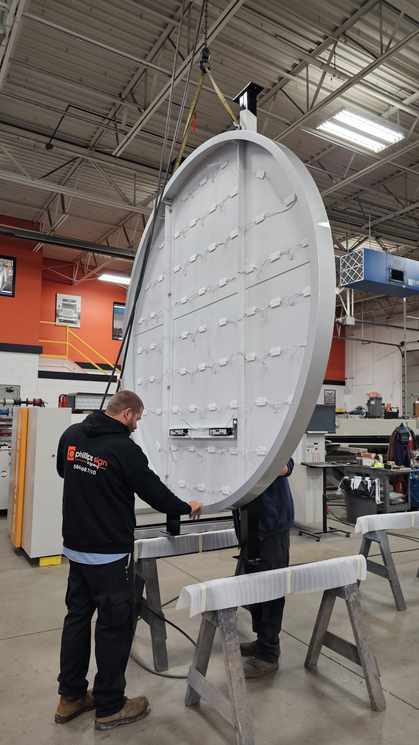 Custom Sign Manufacturing & Fabrication Process Custom illuminated sign manufacturing process with LED module installation in Michigan sign fabrication shop